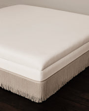 The Bridstow Ottoman with fringe detailing by Collection Seven